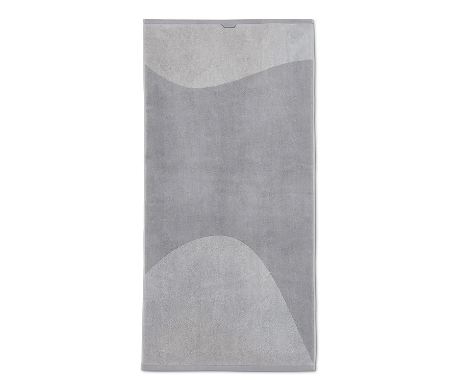 Graues Jacquard-Badetuch mit abstraktem Muster.