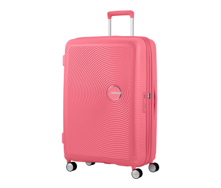 Nahaufnahme eines großen, korallenroten American Tourister Hartschalenkoffers »Soundbox« Spinner.