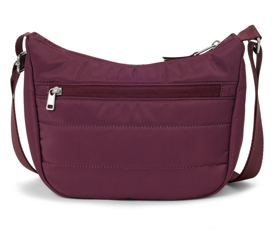 Eine kastanienbraune Handtasche mit verstellbarem Riemen.
