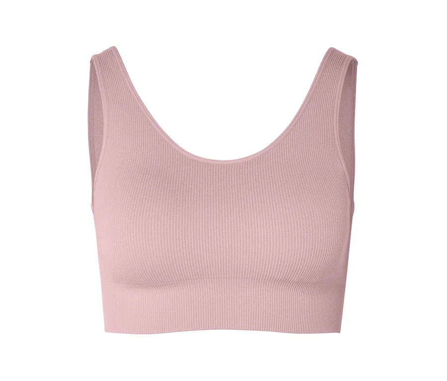 Nahaufnahme eines gerippten, rosa Sport-BHs mit V-Ausschnitt vor einem weißen Hintergrund.