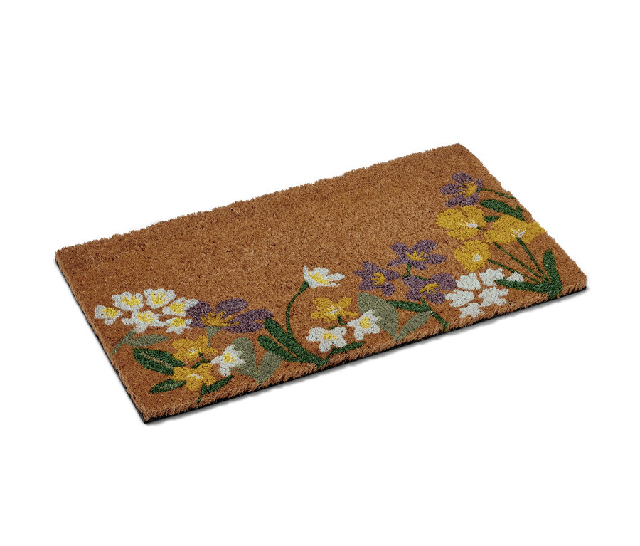 Eine Kokos-Fußmatte mit Blumenmuster.