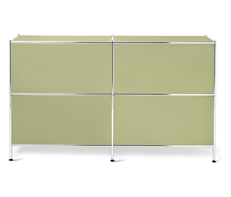 Ein grünes Sideboard mit silbernen Rahmen und schwarzen Füßen.