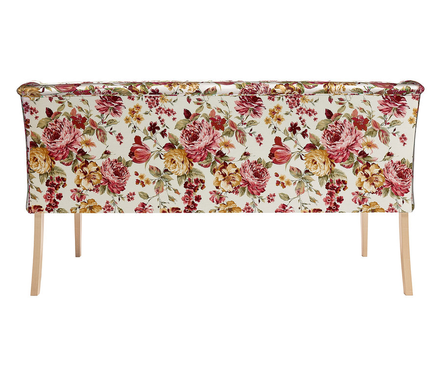 Möbelstück mit einem floral gemusterten Bezug und hellen Holzbeinen.