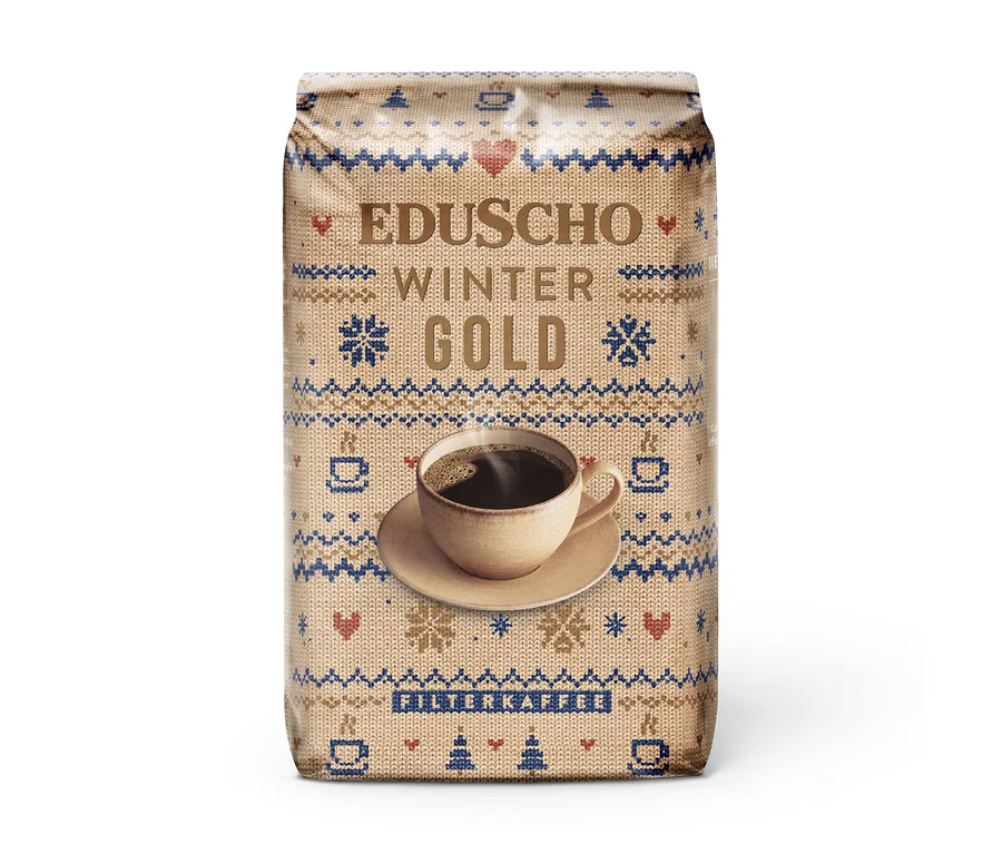 EDUSCHO Wiener Gold Ltd. Winter Edition 500g Kaffeepackung mit ganzen Bohnen, im beigen Strickpullover-Design mit blauen und roten Mustern und einer Tasse Kaffee.