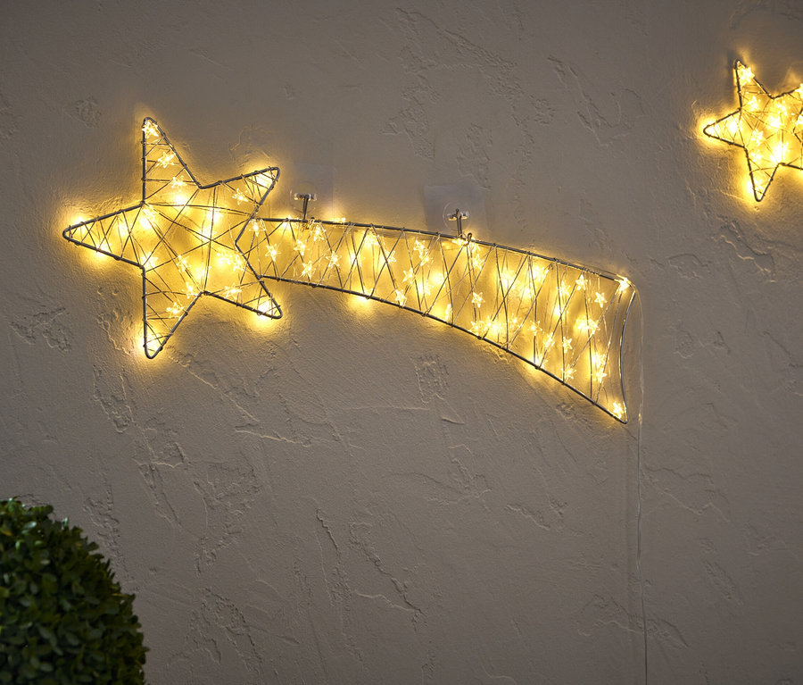 Zwei große LED-Sternschnuppen an der Wand.