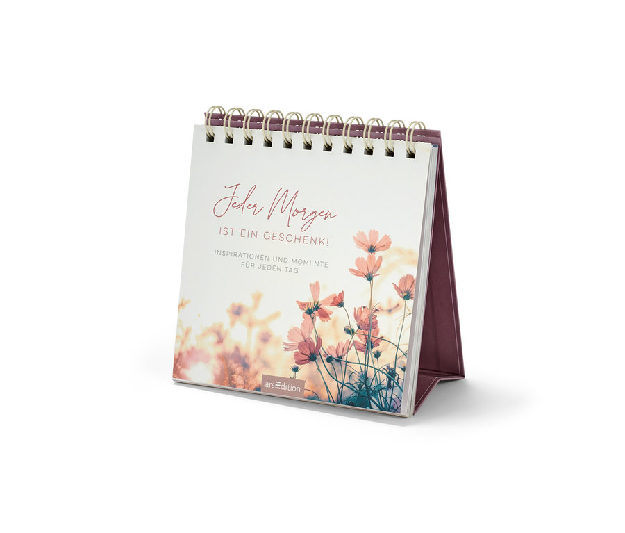 Ein Tisch-Aufsteller Buch mit dem Titel "Jeder Morgen ist ein Geschenk" (Jeder Morgen ist ein Geschenk) mit einer Illustration von Blumen.