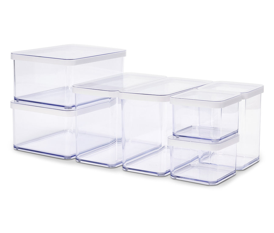Eine Anordnung von durchsichtigen Behältern unterschiedlicher Größe mit weißen Deckeln.